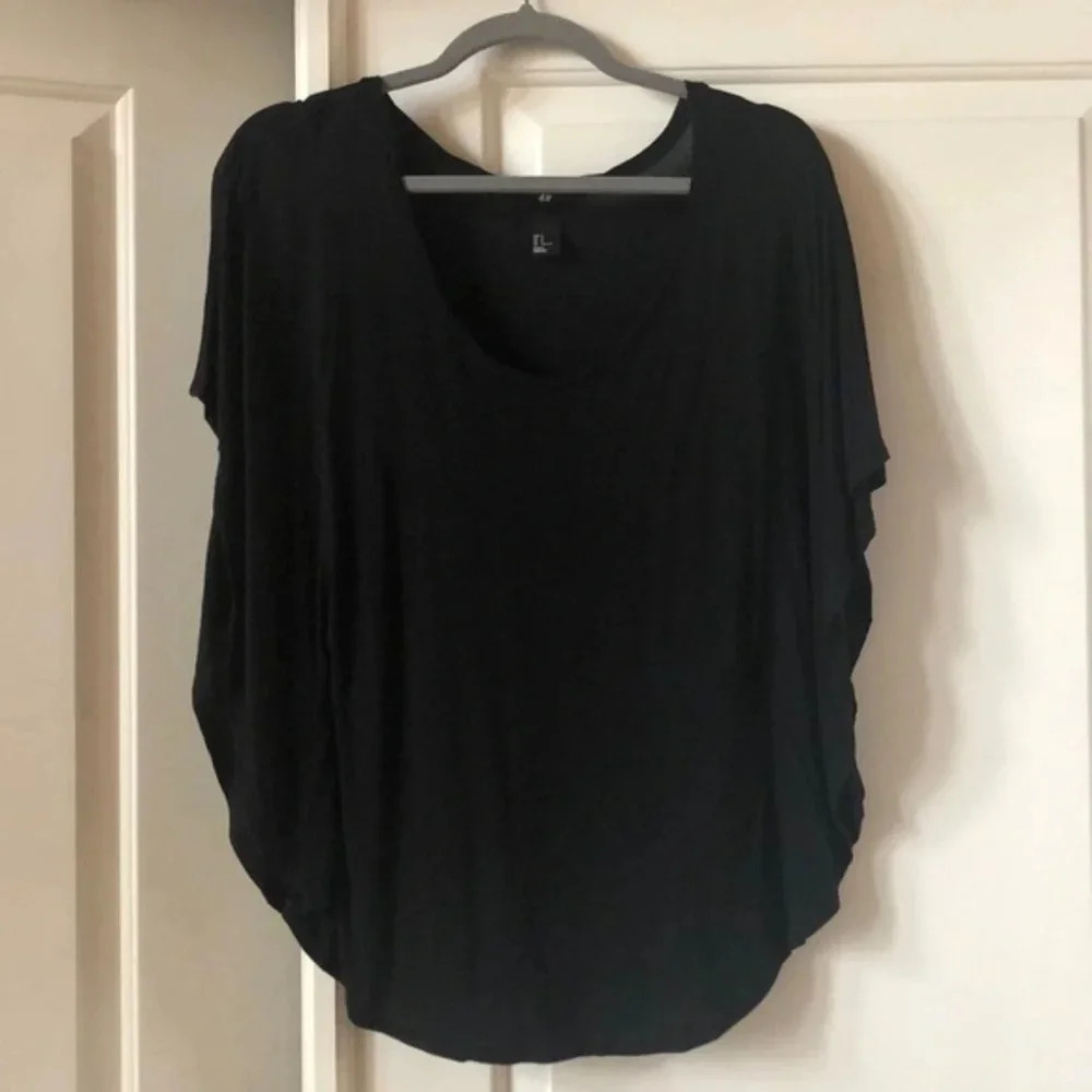 H&M black flowy shirt with large cutout sleeves, size small